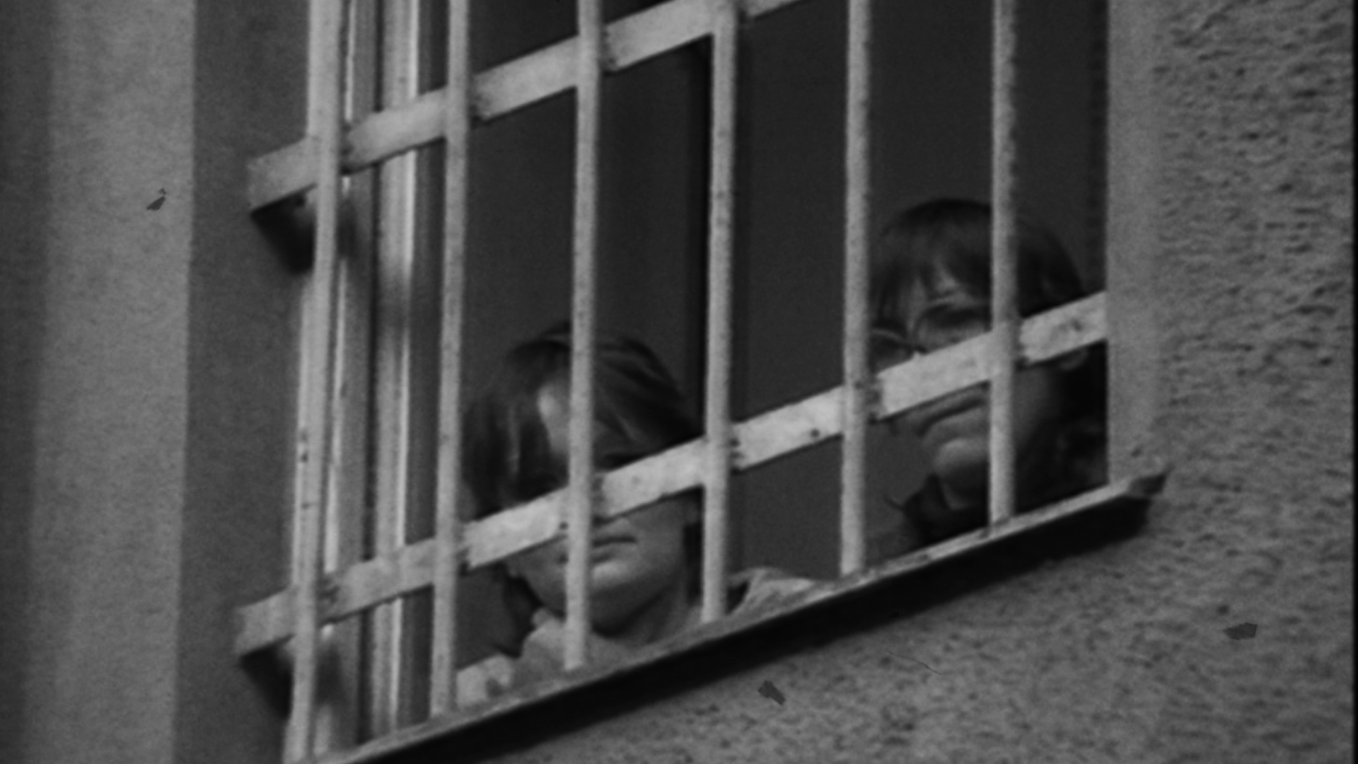 women look through prison window - archive footage
